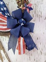 Stars and Stripes Wreath with patriotic whirligigs